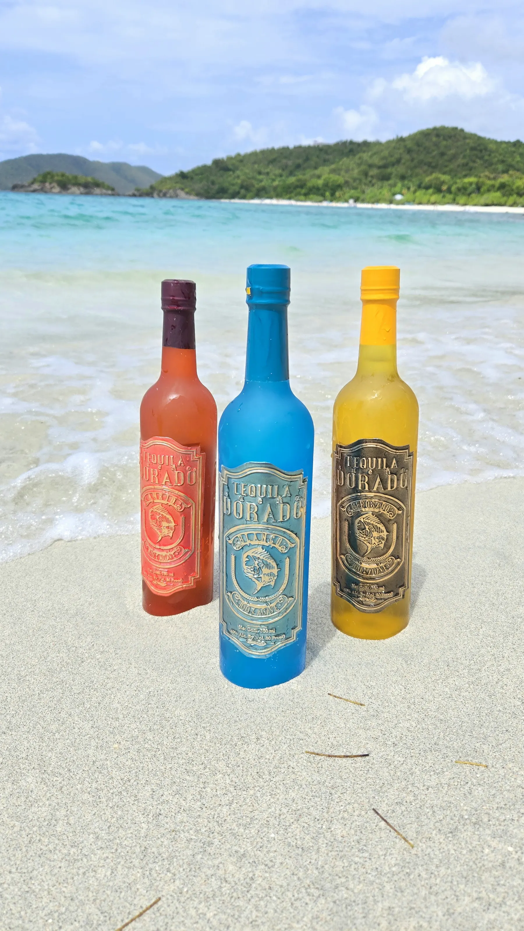 The Dorado Tequila trio standing in the surf on a St. Thomas beach